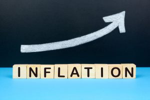 インフレ_Concept of Inflation. Rising chart on the background with the text inflation.